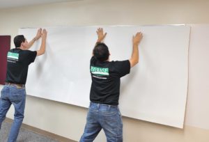 installing whiteboard resurfacing material